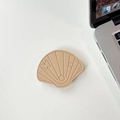 Detail of shell-shaped beige leather phone socket with intricate butterfly stitching - Leather Shell-Khaki
