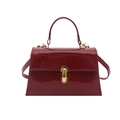 Glossy red patent leather handbag with gold capsule buckle and shoulder strap - Red