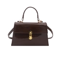 Glossy chocolate brown patent leather crossbody bag with gold buckle and top handle - Brown
