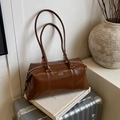 Deep brown glossy bowling bag with long shoulder straps and white logo on suitcase - Brown