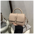 Close-up of light beige tote bag featuring litchi texture and gold buckle detail - Khaki