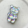 Detailed macro of a 3D holographic bear phone socket with vibrant rainbow light effects - Bear / Silver Laser