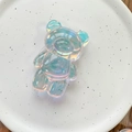 Detailed view of an aurora holographic bear phone grip with iridescent reflections - Bear / Blue