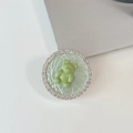 Détail du support téléphone ours vert avec strass brillants et texture craquelée - Support Transparent-Strass Perle-Ours Dopamine / Vert