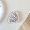 Detailed macro view of an elegant purple flower motif with pearlescent resin petals - Foil Texture Style 5