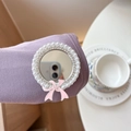Detail of a pearl and crystal inlaid circular mirror phone stand with a pink bow accent - Pearl Ribbon Mirror - Silver Pink