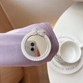 Nahaufnahme einer Handyhalterung mit Perlenrand und kristalbesetzter Schleife - Kleine Schleife Perlenspiegel - Silber