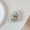 Close-up of floral phone socket with silver flower and golden bow on a pearl texture - Foil Texture Style 8