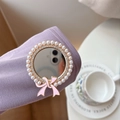 Detail of round pearl mirror phone grip with pink bow and crystal inlay decoration - Pearl Ribbon Mirror - Gold Pink