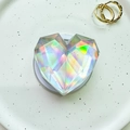 Close-up of holographic heart-shaped phone grip with multi-faceted crystal design - Magnetic Geometric Large Heart - Silver Laser