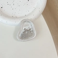 Dettaglio del supporto per telefono con fiocco argento e finitura metallica con trama martellata - Texture in Alluminio #14