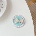 Detail of blue bow-shaped collapsible phone grip with black polka dots and gift text - Magnetic Polka Dot Bowknot / Green