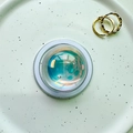 Detailed macro view of iridescent crystal ball phone socket with bubble texture inside - Magnetic Crystal Ball - Blue Light