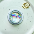 Close-up of a holographic 3D crystal ball phone socket with aurora iridescent effect - Magnetic Crystal Ball - Silver Laser
