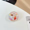 Detail of hemispherical phone grip featuring a miniature koi fish and seashell landscape - Double Conch Goldfish Style (Blue Light No. 7)