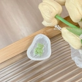 Close-up of magnetic phone grip featuring a cute green bear on a marble texture base - Transparent Socket (Green)