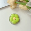 Macro shot of green flower phone socket with MagSafe base and Gift For You text detail - Fruit Green