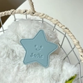 Macro view of blue leather star phone grip with smile embossing on white fur background - Light Blue (Transparent Stand - Leather Pentagram)