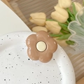 Detail of flower phone grip with glossy coffee petals on a minimalist ceramic plate - Brown Flower