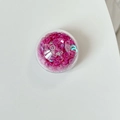 Detailed top view of a round phone socket with shiny pink sequins inside transparent shell - Colorful Sequins-Rose Red