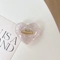 Detalle de soporte de corazón rosa para móvil con purpurina plata y placa dorada - Soporte Corazón 3D - Papel de Plata Inglés - Rosa
