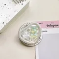 Close-up of heart-shaped phone grip with iridescent 3D bear, star, and pearl accents - Magnetic Type Irregular Ring Tinfoil Texture Pearlescent Sea Star Bear / Green