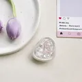 Detail of sweet bear and star resin design for a folding phone grip on white background - Airbag Type Irregular Ring Tinfoil Texture Pearlescent Sea Star Bear / Pink
