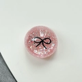 Dettaglio del supporto per telefono con glitter rosa e design a fiocco nero minimalista - Supporto Sfera di Cristallo-Pois Glitter Fiocco Nero / Rosso