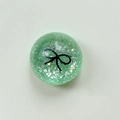 Detail of green sequin sphere phone socket with black bow pattern and glitter texture - Crystal Ball Stand-Dots Glitter Black Bowtie / Dark Green