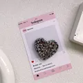 Close-up of heart-shaped glitter phone socket with sparkling sequins and resin finish - Sequin Epoxy Heart Stand - High Shine Black