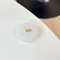 Detailed view of handmade shell-shaped phone grip with glitter and gold metal plaque - Adhesive Glitter Gold Label Shell - Silver Sparkle