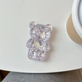 Détail du support de téléphone ours à paillettes violettes avec motif cœur sur fond blanc - Violet