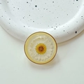 Macro view of floral phone grip featuring real white daisy embedded in clear resin - Cloud Shimmer Yellow (Transparent Stand-Gold Ring Real Flower Daisy)