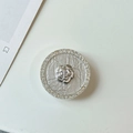 Macro detail of rhinestone-encrusted flower phone grip with silver camellia floral design - Transparent Airbag Stand (Silver Camellia) / Silver