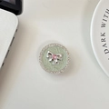 Detail of mint green phone socket with silver bow, pink heart gem and rhinestones - Green