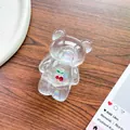 Detail of laser iridescent bear phone grip with cherry ornament on dark wood background - Bear Stand - Rhinestone Cherry - Aurora