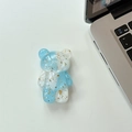 Detail of blue and white gradient bear phone grip with shiny gold foil flakes - Blue White