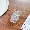 Detail of laser iridescent bear phone grip with cherry pattern on a wooden table - Bear Stand - Rhinestone Cherry - Blue Light