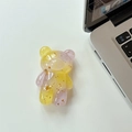 Detail of bear phone grip with gold foil sequins in purple and yellow resin - Purple & Yellow