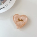 Detailed view of pearlescent pink heart phone grip with golden Smile lettering - Large Heart Grip-Cloud Gold Smile-Colorful