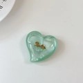 Detail of light green glitter heart phone grip with a golden Smile emblem on white background - Large Heart Grip-Cloud Gold Smile-Fruit Green