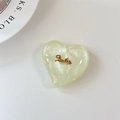 Gros plan d'un support de téléphone en forme de cœur à paillettes avec décor Smile - Grande Poignée de Coeur-Sourire d'Or de Nuage-Vert Clair