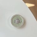 Macro detail of planet emblem phone grip with green leather base and crystal border - Transparent Stand-Rhinestone Pearl-Planet-Green