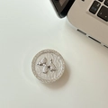 Close-up of silver rhinestone dog phone grip holder with sparkling balloon dog design - Silver