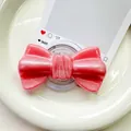 Macro view of pink glitter bow phone grip featuring shimmering pearlescent particles - Pearlized Large Bowknot-Red