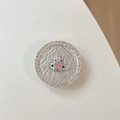 Macro shot of silver planetary phone grip with pink stone and sparkling rhinestones - Pink Rhinestone Planet - Silver
