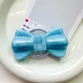 Macro detail of magnetic glittery blue bow phone grip holder on white ceramic plate - Pearlized Large Bowknot-Light Blue