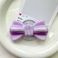 Macro shot of purple glitter bow magnetic phone grip on a white ceramic tray - Pearlized Large Bowknot-Purple