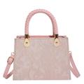 Pink woven floral handbag with gold hardware and adjustable strap on white background - Pink