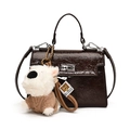 Deep brown patent leather Kelly bag with crinkle texture and plush puppy charm - Coffee With Pendant